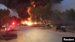 First responders are at the scene of Colonial Pipeline Co. explosion and fire in this Alabaster Fire Department photo in Shelby, Alabama, Oct. 31, 2016. 