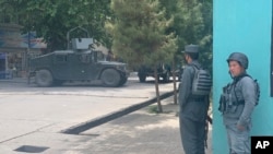 Afghan police arrive at the site of an explosion in a mosque, June 12, 2020, in Kabul, Afghanistan. 