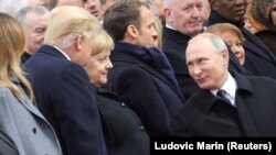  Donald Trump, Angela Merkel, Emmanuel Macron et Vladimir Poutine, centenaire de l'armistice, Paris, le 11 novembre 2018.