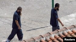 Hai người Uighur được trả tự do khỏi Guantanamo vào năm 2006 tại một trung tâm tái định cư ở Tirana, Albania.