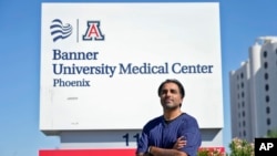 Dr. Aneesh Naran stands outside the Banner University Medical Center emergency room after his shift, Oct. 7, 2024 in Phoenix.