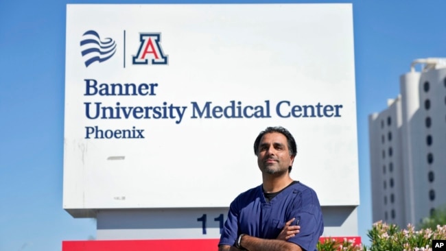 Dr. Aneesh Naran stands outside the Banner University Medical Center emergency room after his shift, Oct. 7, 2024 in Phoenix.