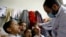 Syrian children receive vaccination against polio at a Syrian refugee camp in Lebanon, Nov. 7, 2013.