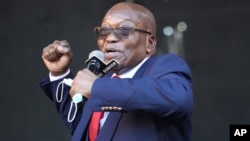 Former South African President Jacob Zuma, addresses supporters outside the High Court in Pietermaritzburg, South Africa, Wednesday May 26, 2021 where he faces charges of corruption. Zuma pleaded not guilty to corruption, racketeering, fraud, tax…