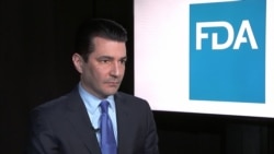 FILE - Then-Food and Drug Administration Commissioner Scott Gottlieb listens during an interview with The Associated Press in New York, March 5, 2018.