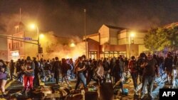 George Floyd protesters set Minneapolis police station afire