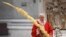 Pope Francis holds a palm branch as he celebrates Palm Sunday Mass behind closed doors in St. Peter's Basilica, at the Vatican, April 5, 2020, during the lockdown aimed at curbing the spread of the COVID-19 infection, caused by the novel coronavirus.
