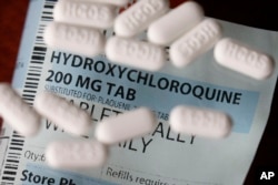 FILE - This April 6, 2020 photo shows an arrangement of Hydroxychloroquine pills in Las Vegas.