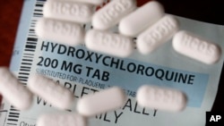 FILE - An arrangement of Hydroxychloroquine pills in Las Vegas. 
