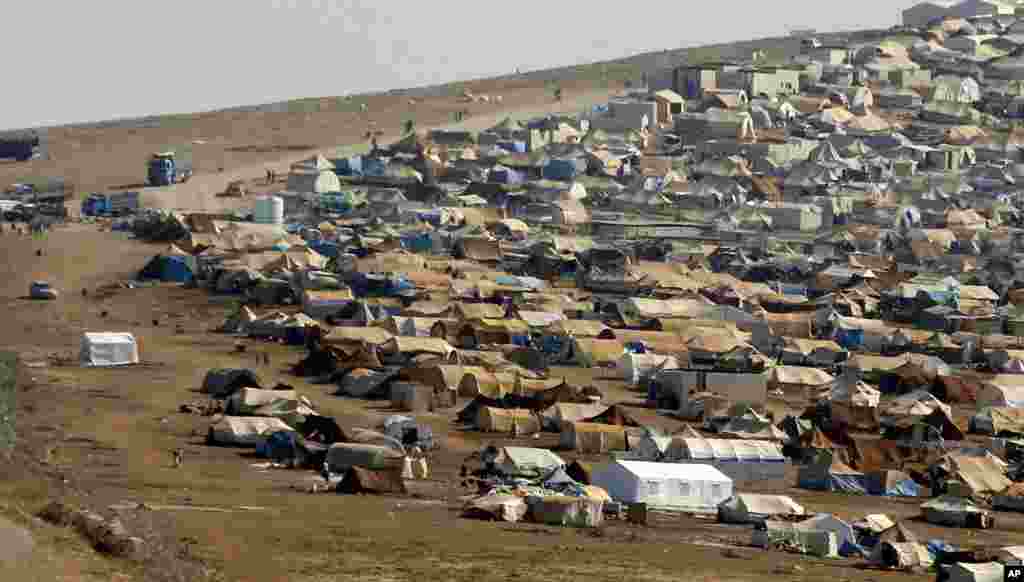 A refugee camp is seen in Syrian territory near the Turkish border town of Cilvegozu, Sept. 3, 2013. 