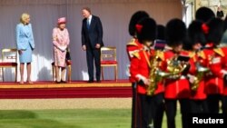 U.S. President Joe Biden, first lady Jill Biden and Britain's Queen Elizabeth stand in front of members of the Royal Guard, at Windsor Castle in Windsor, Britain, June 13, 2021.