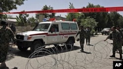 An ambulance leaves Kabul's main military hospital in Kabul, Afghanistan, Saturday, May 21, 2011