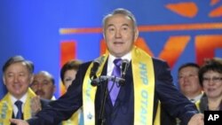 Kazakhstan's President Nursultan Nazarbayev, wearing a scarf of the Nur Otan party, delivers a speech during a 'Forward, Kazakhstan' forum organized by activists and supporters of the ruling party in Astana, January 16, 2012.