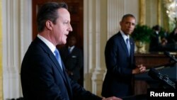 FILE - U.S. President Barack Obama and British Prime Minister David Cameron appear at a press conference following their meeting at the White House in Washington, January 2015. 