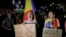 Protesters shout anti-government slogans holding a banner that reads "PSD (Social Democratic Party) - The red plague" outside the government headquarters in Bucharest, Romania, Sunday, Aug. 27, 2017. 