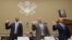 Witnesses, from left, Paul Combetta and Bill Thornton, both of Platte River Networks, and Justin Cooper are sworn in on Capitol Hill in Washington, Sept. 13, 2016, prior to a congressional panel hearing on Hillary Clinton's use of a private email server.