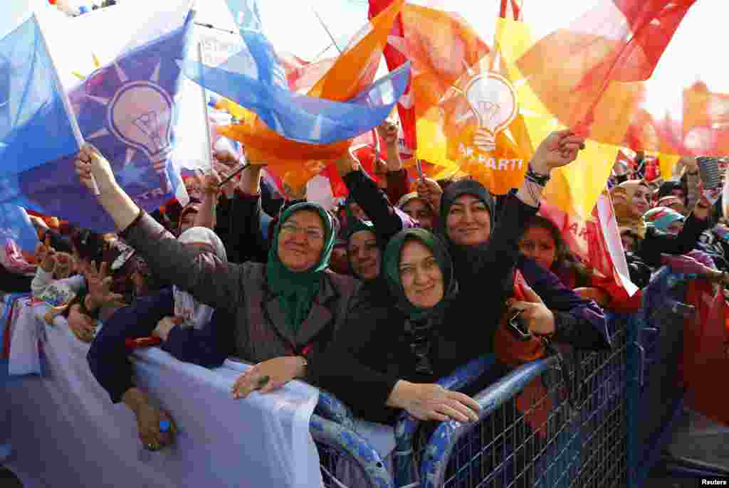 Supporters of the ruling AK Party wave party flags during an election rally in the central Anatolian city of Konya. Turkey holds its second general election of the year on Nov. 1, a snap vote which President Tayyip Erdogan hopes will see the ruling AK Party win back the majority it lost five months ago.