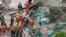 Firefighters work at the site of a collapsed building in Shanghai, May 16, 2019.