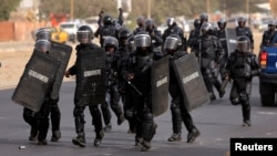 Riot police officers arrive during clashes with supporters of Senegalese opposition leader Ousmane Sonko after they were prevented from reaching his house in Dakar, Senegal May 29, 2023.