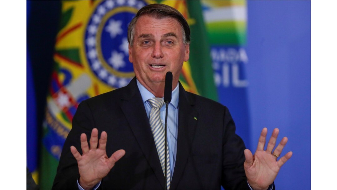 Brazil's President Jair Bolsonaro gestures at the Planalto Palace in Brasilia, Brazil, Feb. 24, 2021.