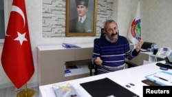 Tunceli Mayor Mehmet Macoglu from the Communist Party of Turkey (TKP) speaks during an interview at his office in Tunceli, Turkey, April 15, 2019.