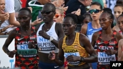 Ugandan marathon runner Rebecca Cheptegei, third from left, competes in the women's final during the World Athletics Championships in Budapest, Hungary, on Aug. 26, 2023. Cheptegei died on Sept. 5, 2024, from burns after being set on fire by her male partner.