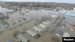 FILE - Flooded areas are seen in Bellevue, Nebraska, U.S., March 19, 2019, in this still image taken from a video obtained from social media on March 20, 2019.