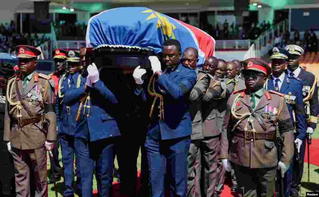 Members of the Namibian military carry the casket with the body of the former president, Sam Nujoma, who became Namibia&#39;s first democratically elected president, during his memorial service in Windhoek, Namibia.