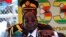 Zimbabwe President Robert Mugabe addresses crowds gathered for the country's 33rd independence celebrations at the National Sports stadium in Harare, April 18, 2013.