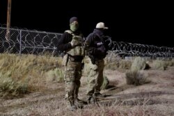 Police officers guard an entrance to the Nevada Test and Training Range near Area 51 near Rachel, Nevada, Sept. 20, 2019.