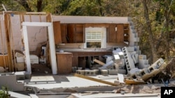 Damaged to one of the White family's homes that was destroyed by Hurricane Helene is seen in Morganton, North Carolina, Oct. 1, 2024.