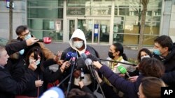 Music producer identified only by his first name, Michel, talks to the media, before going to the Inspectorate General of the National Police in Paris, Nov. 26, 2020. 