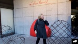 Dagmar Havlova, the widow of late Czech Republic's President Vaclav Havel, poses for a photo by a memorial that was unveiled on the eve of 80th anniversary of his birth in Prague, Czech Republic, Oct. 4, 2016. 