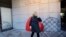 Dagmar Havlova, the widow of late Czech Republic's President Vaclav Havel, poses for a photo by a memorial that was unveiled on the eve of 80th anniversary of his birth in Prague, Czech Republic, Oct. 4, 2016. 