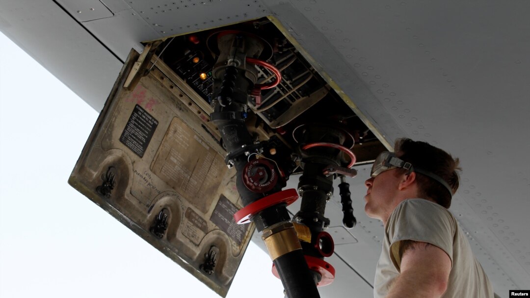 FILE - A U.S. Air Force fuel controller fills a KC-10 Extender that provides midair refueling support to Operation Inherent Resolve over Iraq and Syria, at an Air Force base in the Arabian Gulf, March 13, 2017.