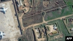 This satellite image released by Maxar Technologies on Dec. 13, 2024, shows Russian S-400 air defense missile systems being assembled to depart from the Russian Hmeimim Air Base in Syria's western province of Latakia.