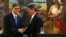 Argentine Finance Minister Alfonso Prat-Gay and U.S. Treasury Secretary Jack Lew shake hands after giving a joint statement in Buenos Aires, Argentina, Sept. 26, 2016. 