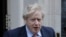 资料照片:英国首相约翰逊离开唐宁街10号前往议会下院接受每周质询。(2020年3月25日)