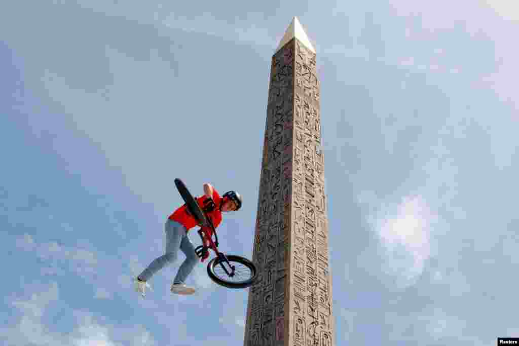 France's BMX team puts on a show at Place de la Concorde, which has been turned into a giant Olympic park ahead of the Paris 2024 Olympics, in Paris.