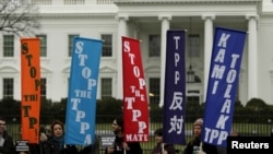 FILE - Opponents of the Trans Pacific Partnership trade agreement protest outside the White House in Washington, Feb. 3, 2016.