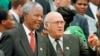 FILE - South African President Nelson Mandela, t, and Deputy President F.W. de Klerk chat outside Parliament after the approval of South Africa's new constitution, May 8, 1996. 