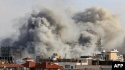 Smoke plumes rise over Gaza City on Oct. 7, 2023, during Israeli air strikes following a major attack on Israel by Hamas.