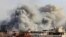 Smoke plumes rise over Gaza City on Oct. 7, 2023, during Israeli air strikes following a major attack on Israel by Hamas.