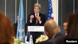 U.S. Secretary of State John Kerry gestures as he delivers a speech to UNESCO Ambassadors and Permanent Delegates at the UNESCO headquarter in Paris, Oct. 18, 2015. 