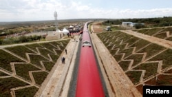 FILE - An aerial view shows a train on the Standard Gauge Railway (SGR) line constructed by the China Road and Bridge Corporation (CRBC) and financed by the Chinese government, in Kimuka, Kenya, Oct. 16, 2019.