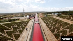 FILE - An aerial view shows a train on the Standard Gauge Railway (SGR) line constructed by the China Road and Bridge Corporation (CRBC) and financed by the Chinese government, in Kimuka, Kenya, Oct. 16, 2019.