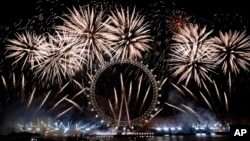 FILE - Fireworks light up the sky over the London Eye in central London on Jan. 1, 2024. Organizers watched poor weather conditions that threaten to cancel the event on Dec. 31, 2024.