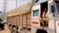 Trucker driver Babloo Yadav complains of long hold ups by tax officials at state border check posts. (A. Pasricha/VOA)