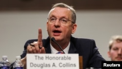 FILE - Former Representative Doug Collins, U.S. President Donald Trump’s nominee for secretary of veterans affairs, testifies before a Senate Veterans Affairs committee confirmation hearing, in Capitol Hill in Washington, Jan. 21, 2025. 