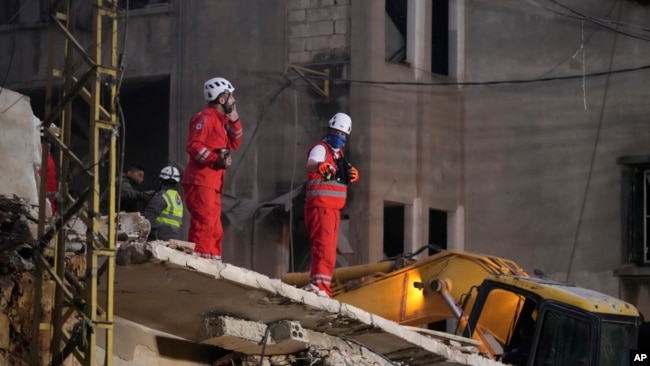 Rescuers search for victims at the site of an Israeli airstrike that targeted a building in Beirut, Lebanon, Nov. 26, 2024.